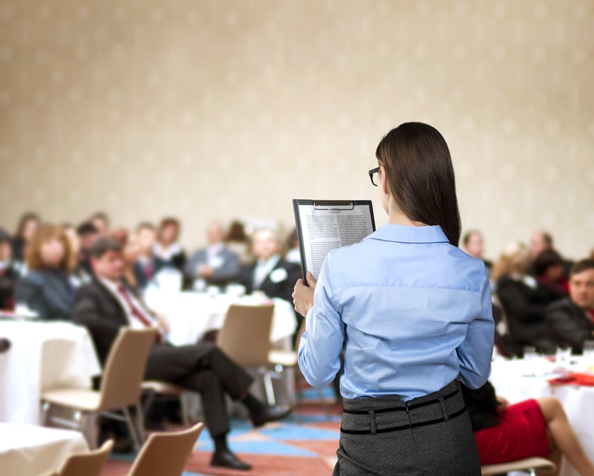 Woman Speaking at a Conference